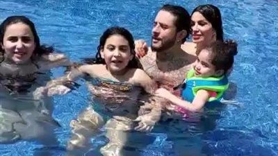 بالفيديو.. أحمد الفيشاوي وزوجته يستمتعان بالمصيف داخل حمام السباحة