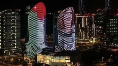 بالصور.. قطر تُضئ أبراج لوسيل بعلم فلسطين وصورة شيرين أبو عاقلة