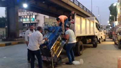 صور.. ضبط وتحرير غرامات للسيارات بالدقي وإزالة أكشاك مخالفه بجنوب الجيزة